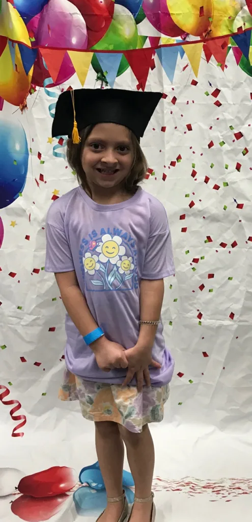 Volunteers and children together at a summer Angel Heart event