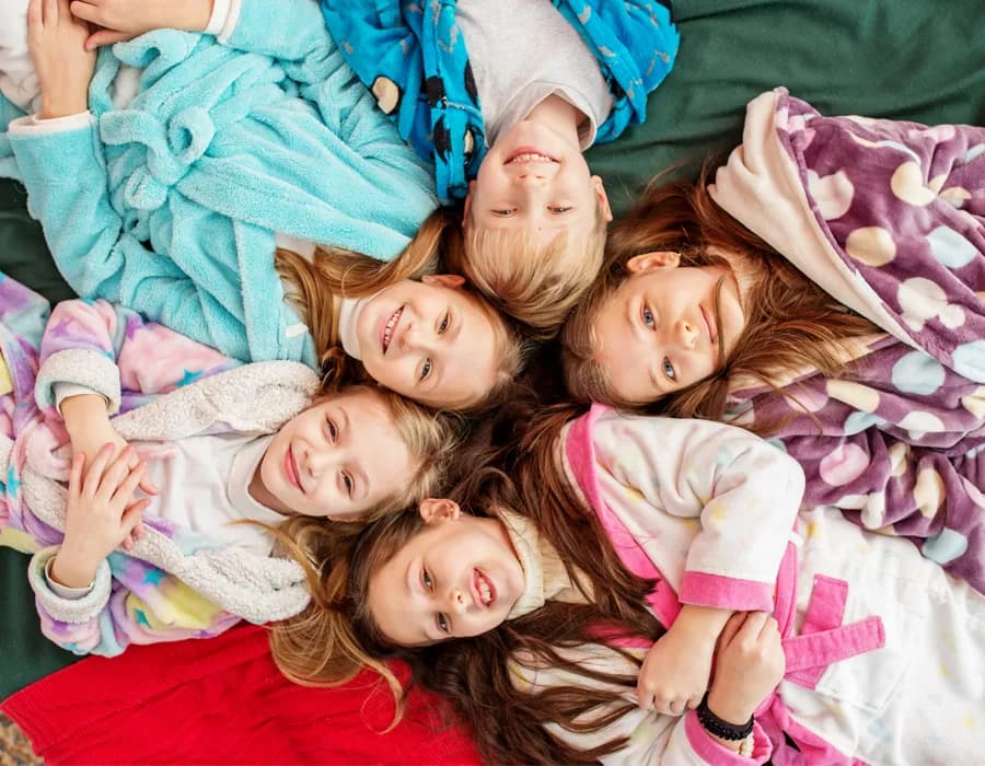 Angel Heart Pajama Project volunteers preparing pajamas, books and cuddle pillows for children
