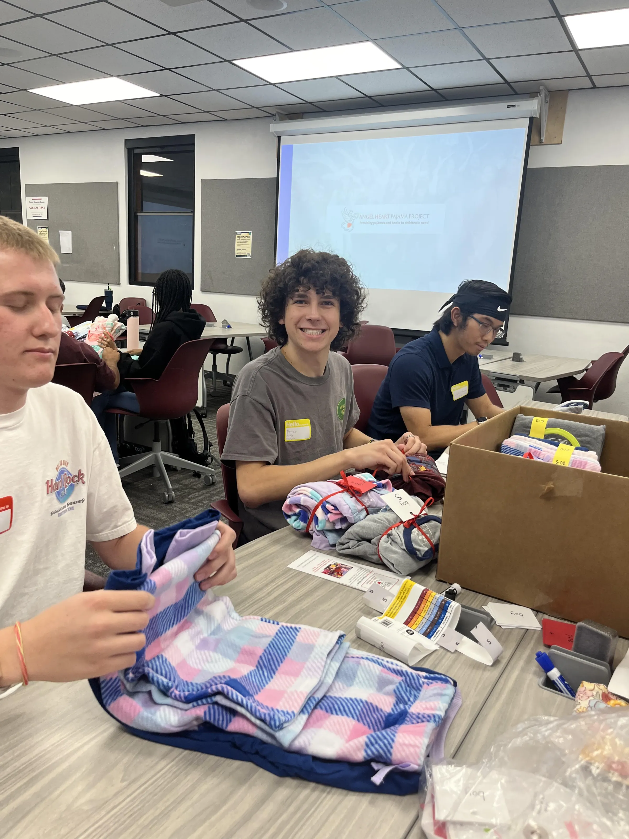 Children and volunteers together at an Angel Heart outreach event