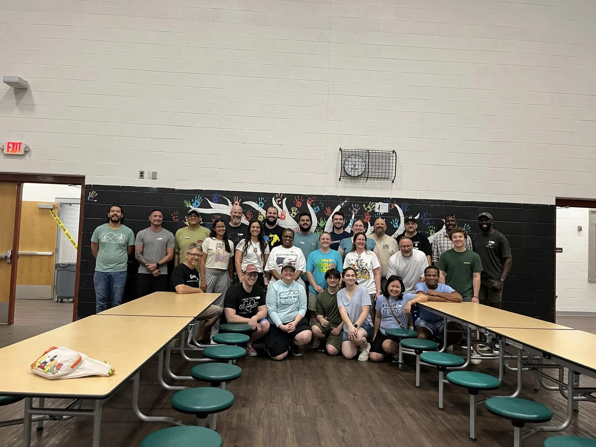 A large group of volunteers gathered together after a pajama-packing session